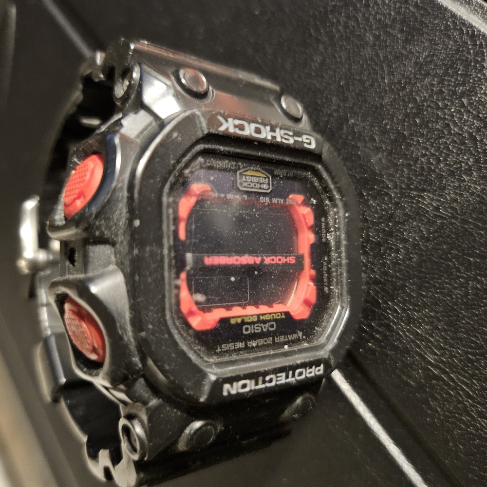 Casio Black and Red Smartwatch with Rugged Design. Needs Battery, And A Band.